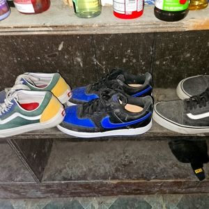 2 pairs of vans an a pair of nikes